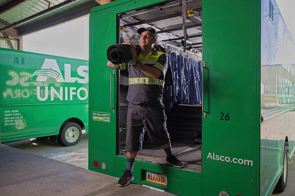 Alsco employee delivering linens