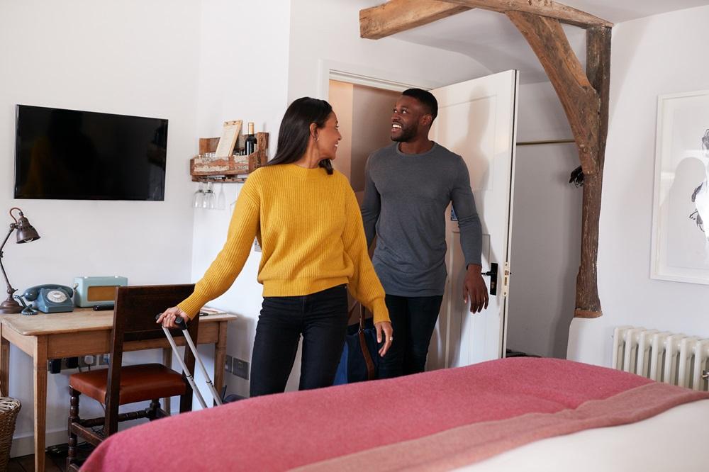 A couple walking into their AirBnB
