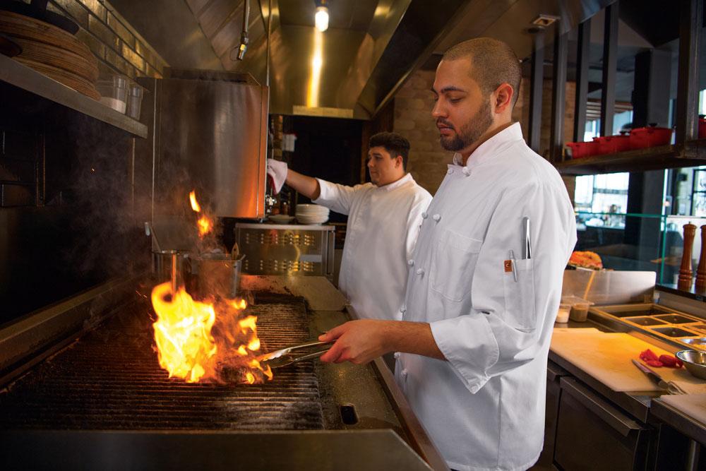 Chefs cooking while wearing clean garments