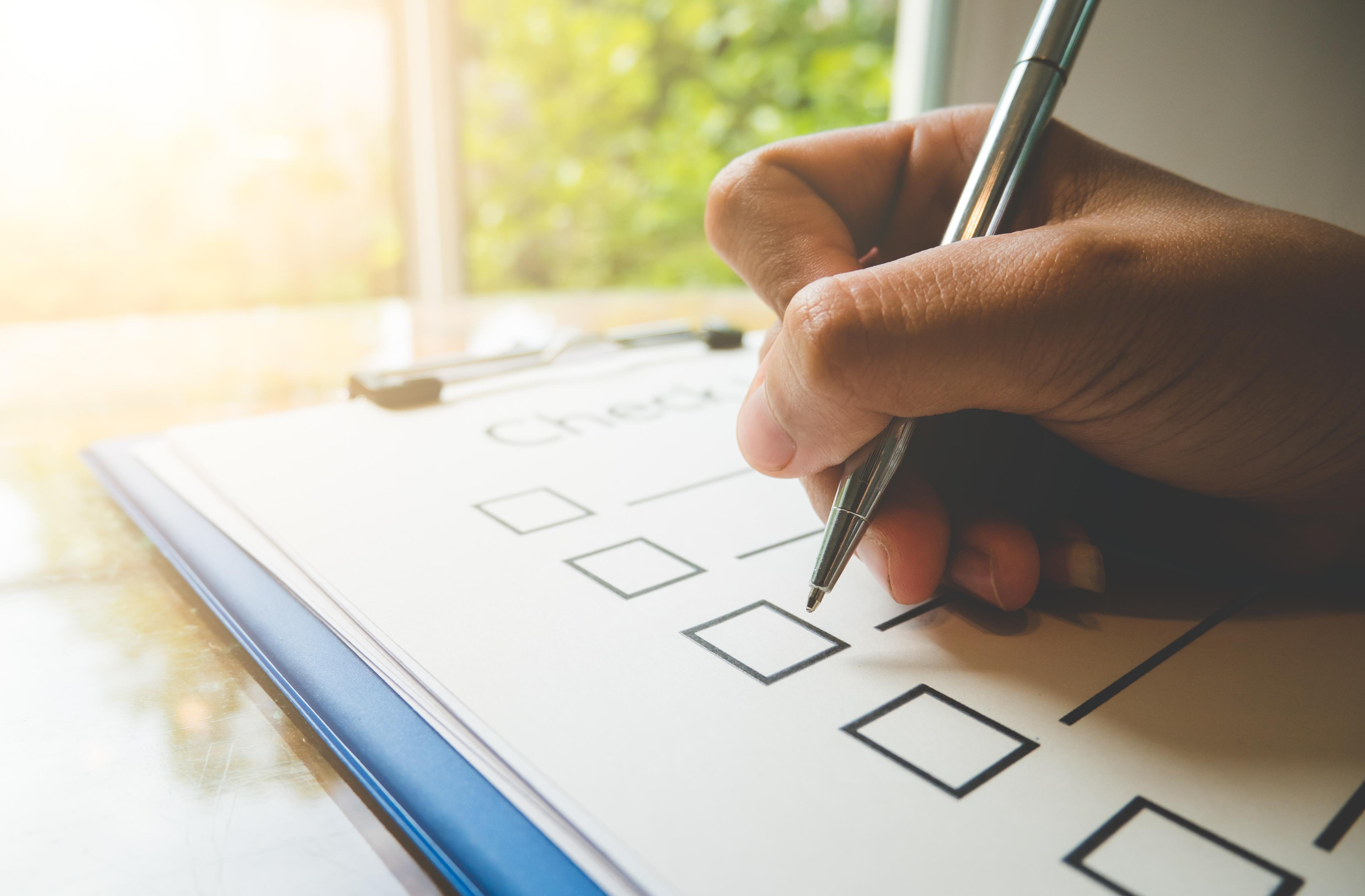 person working through a checklist