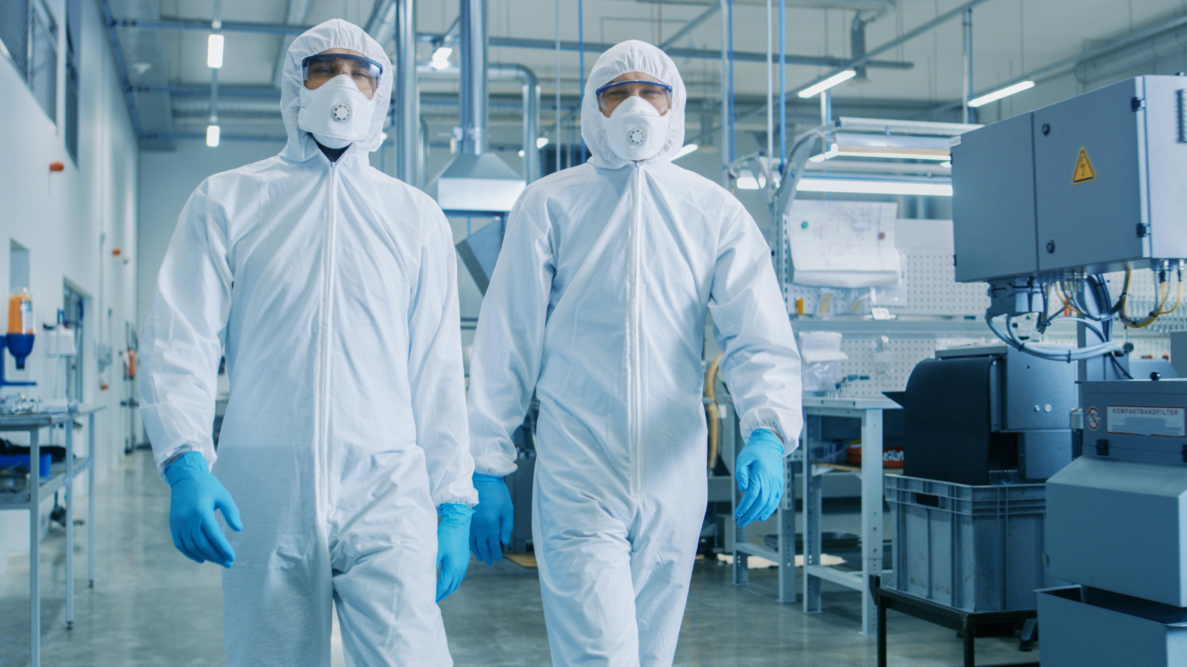 People wearing clean room suits