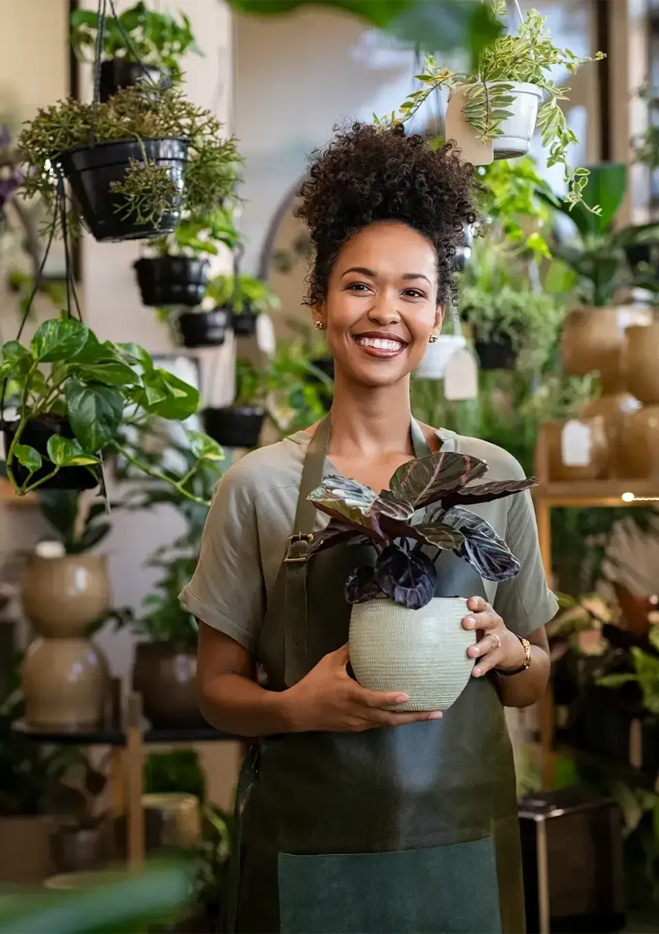 Small Business Owner holding plants