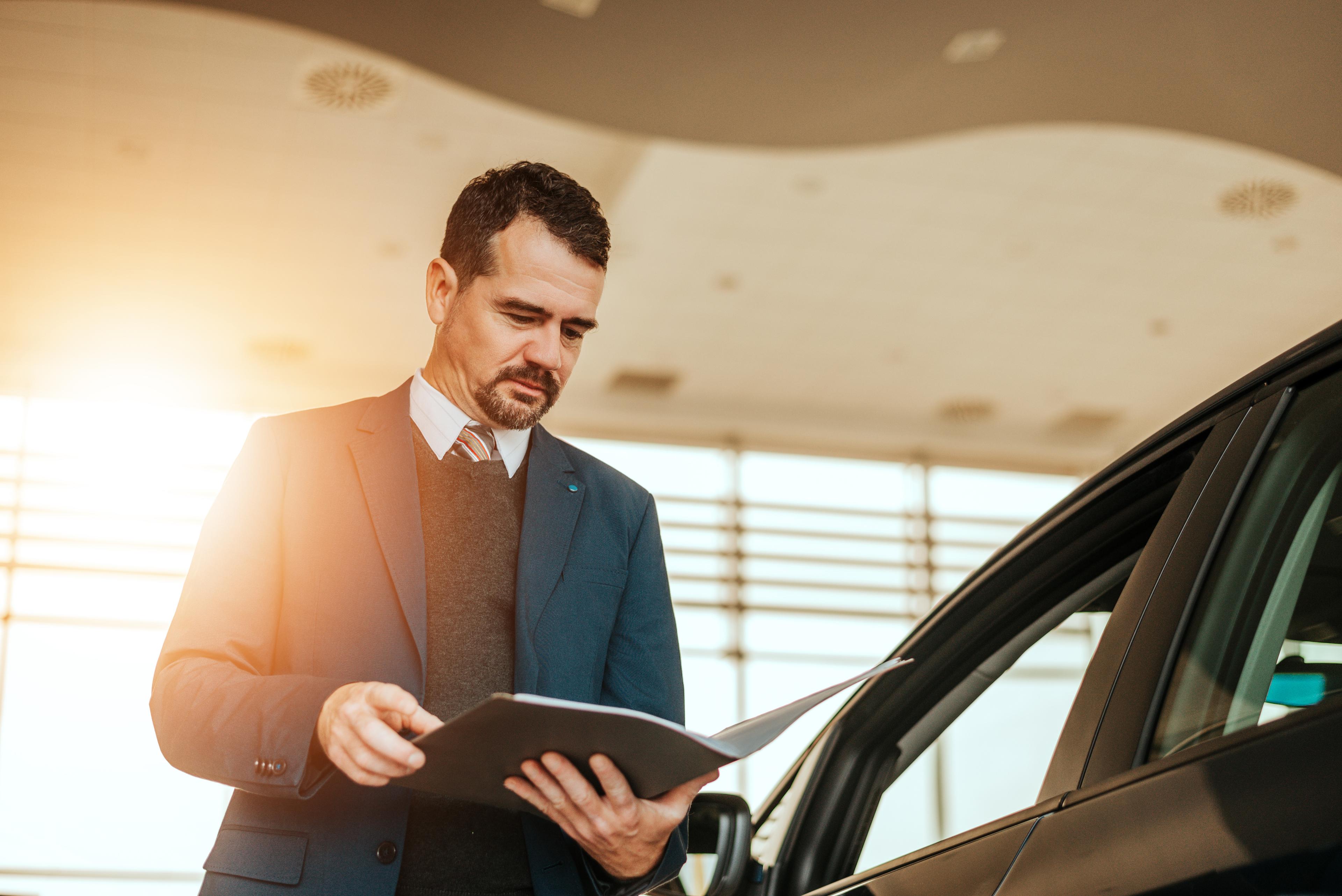 Car Salesman reading