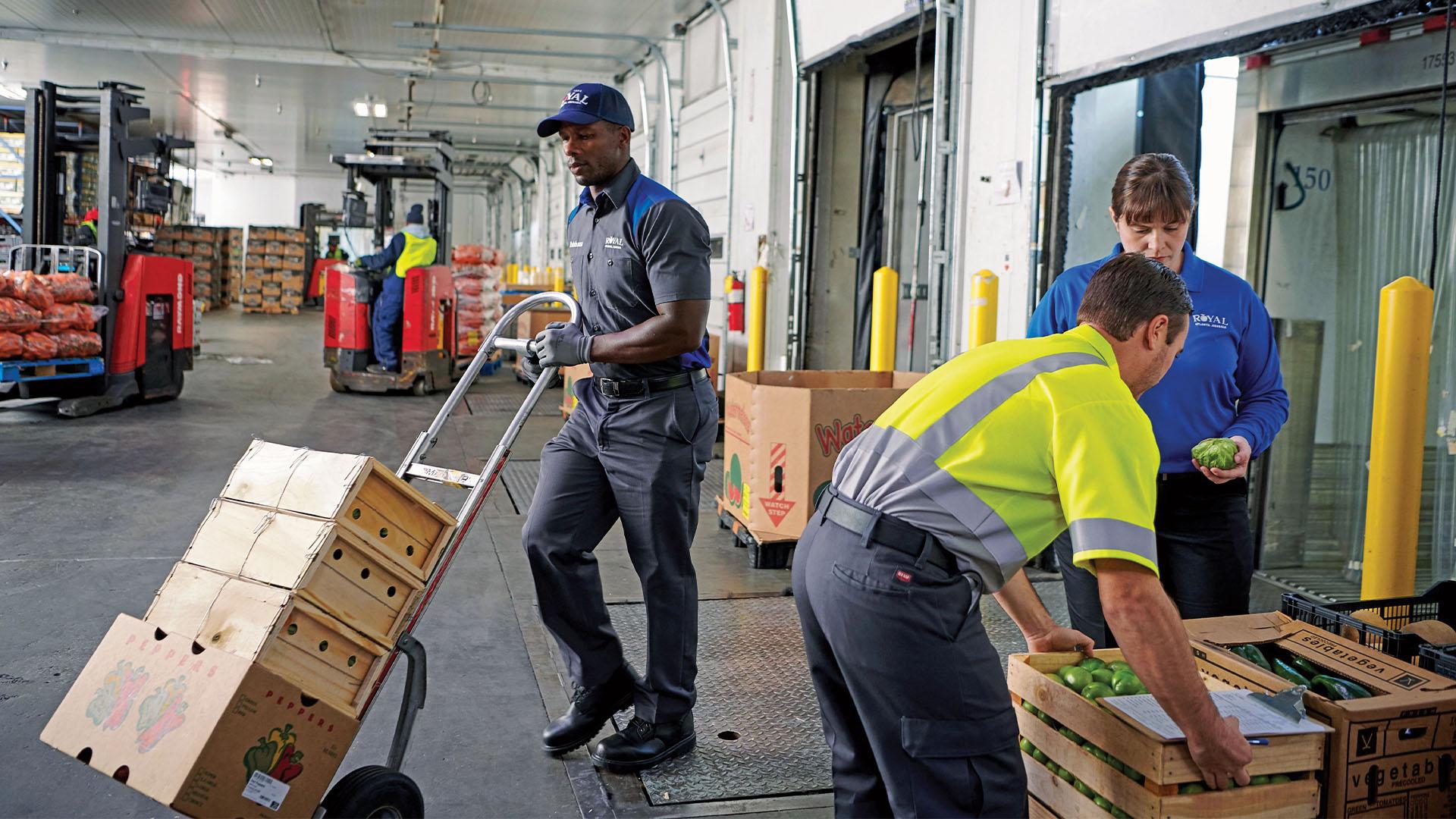 Uniformed workers on a loading dock