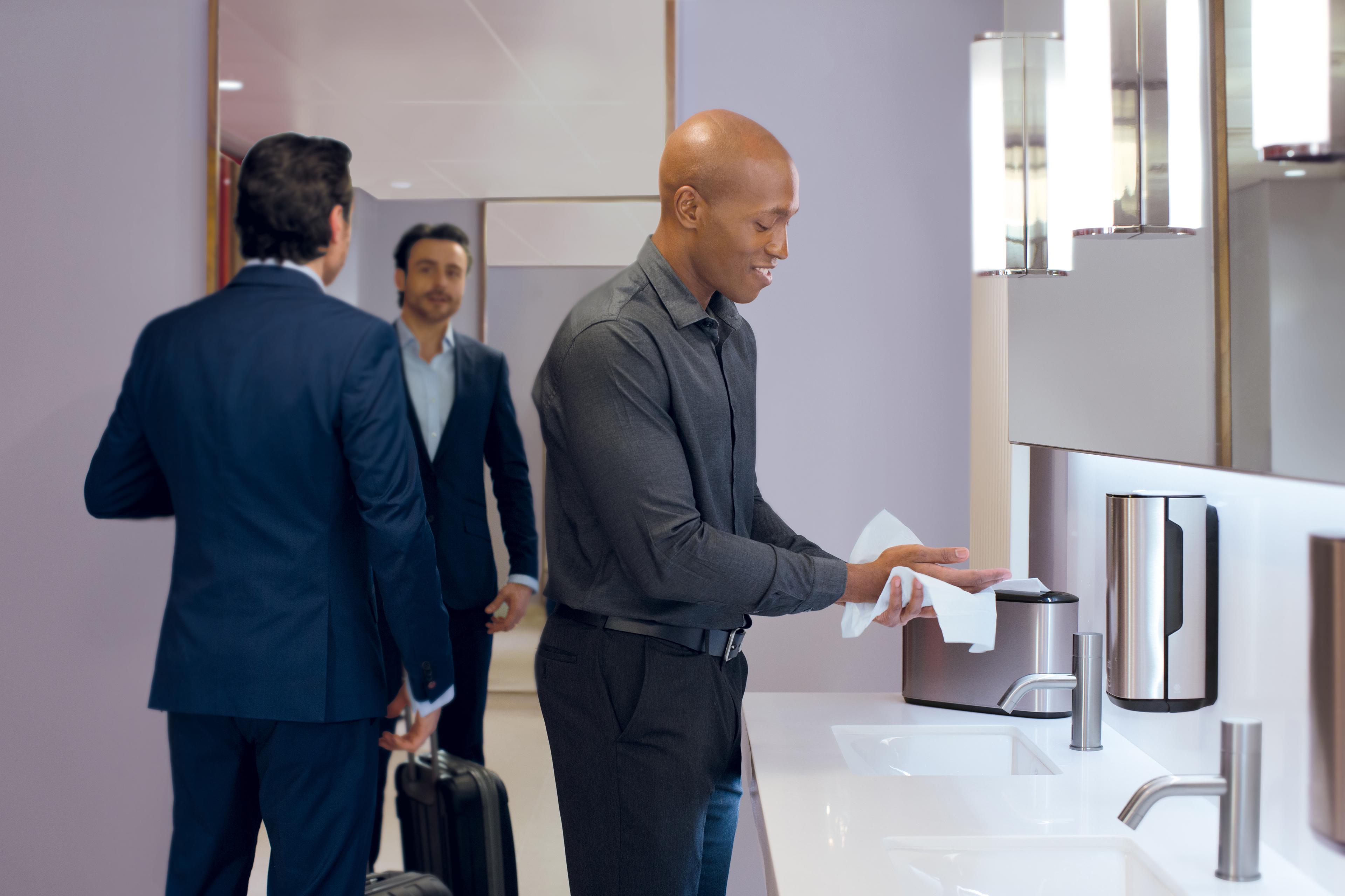 Businessmen in a bathroom