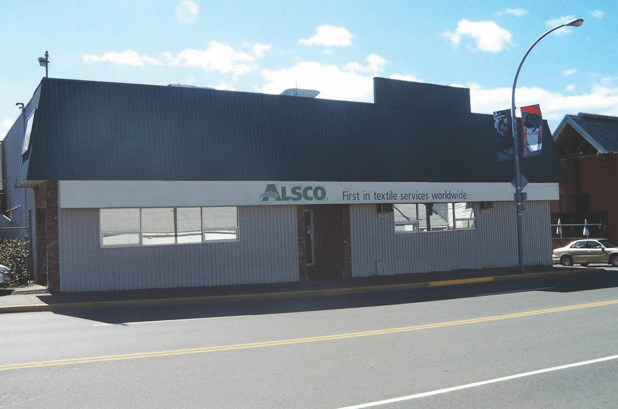This is a photo of the exterior of the Alsco Uniforms location.